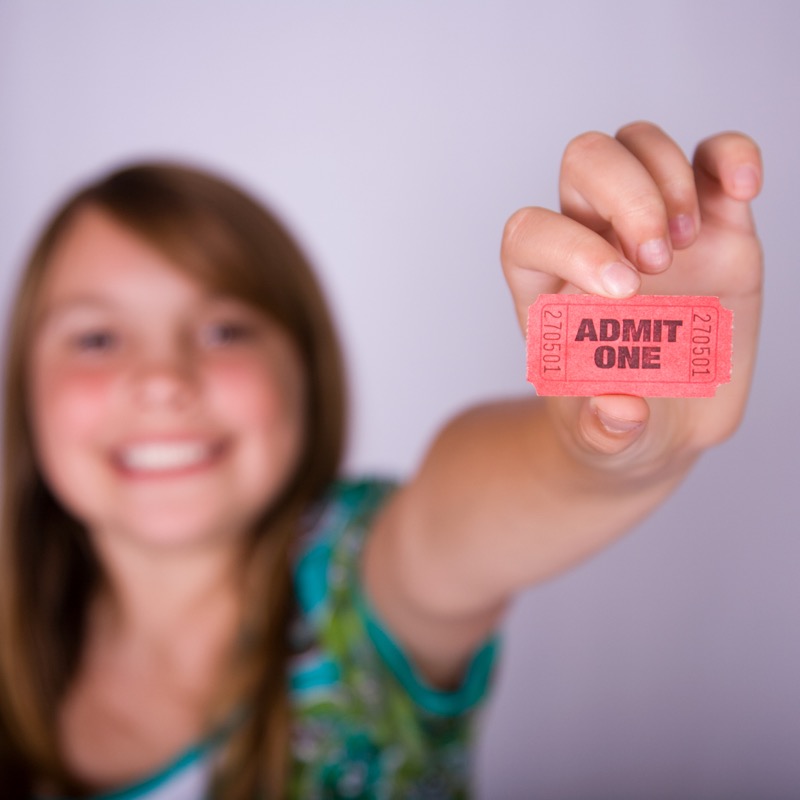 Ticket buyer holding an admit one ticket
